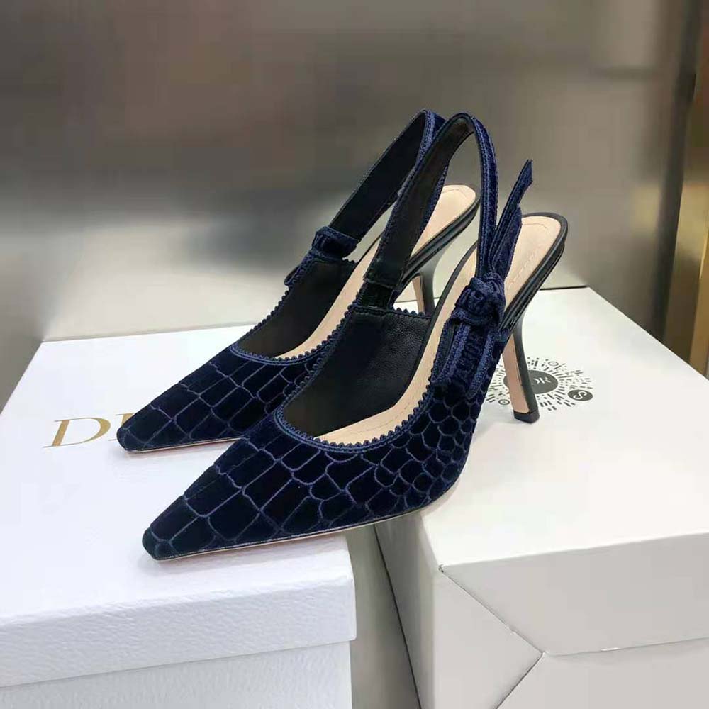 Close-up on embroidered velvet and metal J’Adior detail on Dior slingback pump