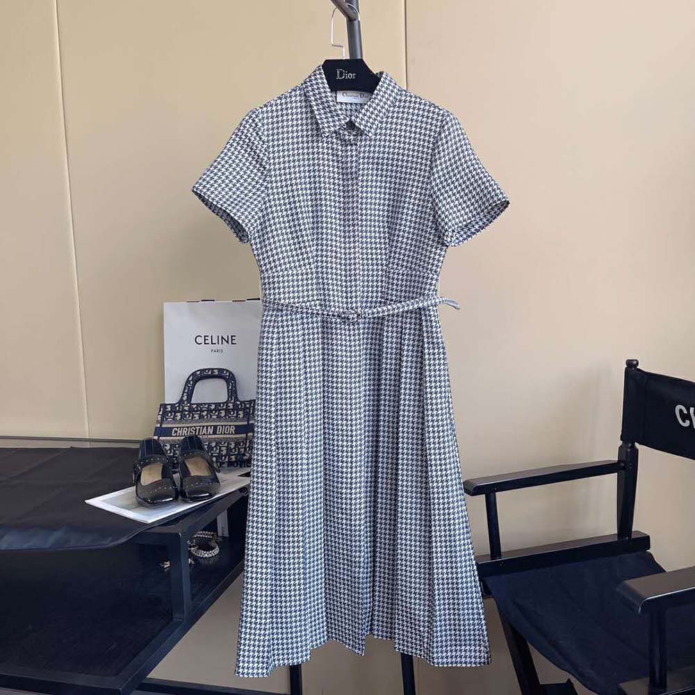 Close-up of black and white jacquard fabric and belt detail on Dior women’s dress