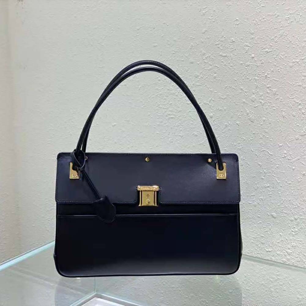 Close-up of Dior signature hardware on Parisienne Bag in black leather