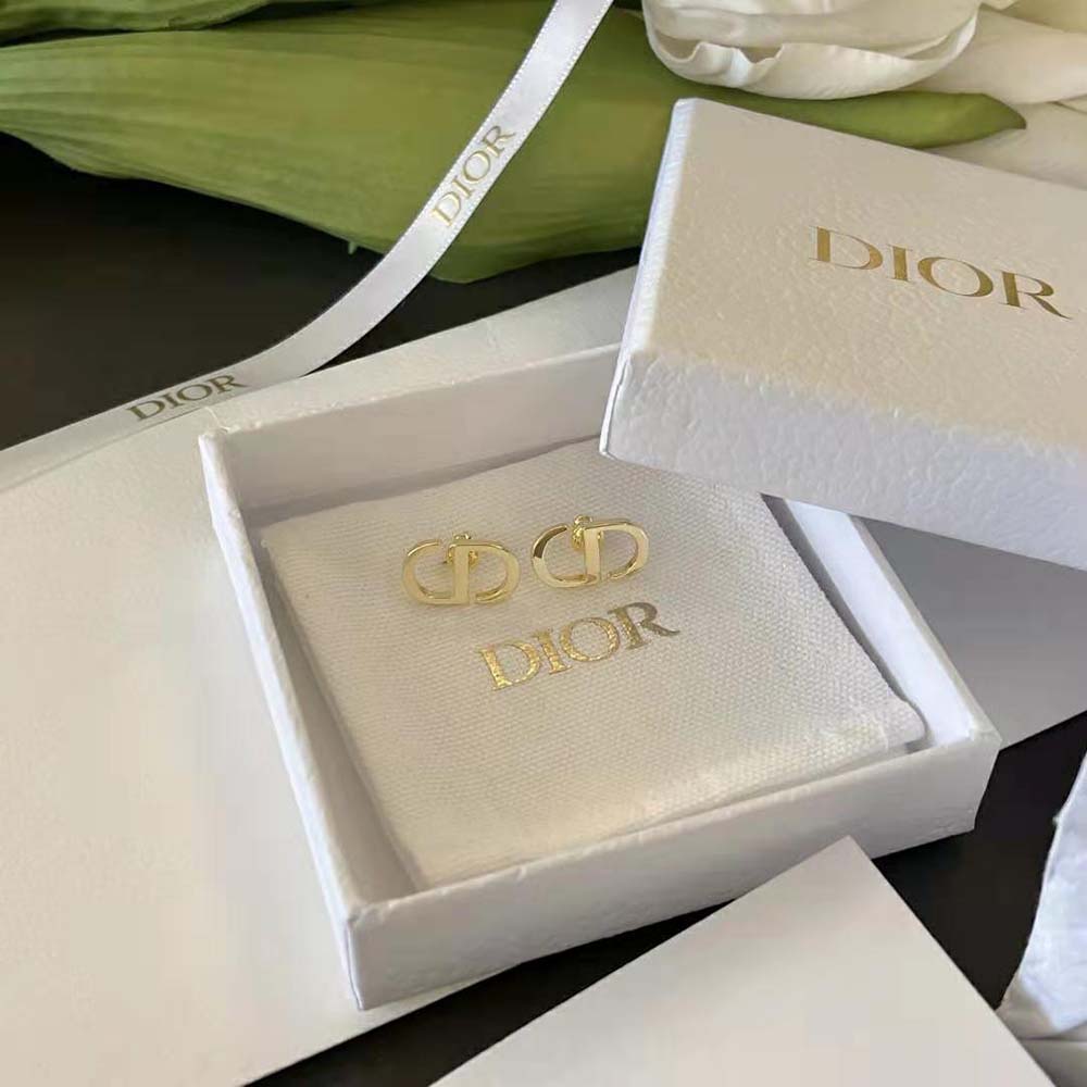 Close-up detail of Dior Women Petit CD Studs Earrings signature CD logo