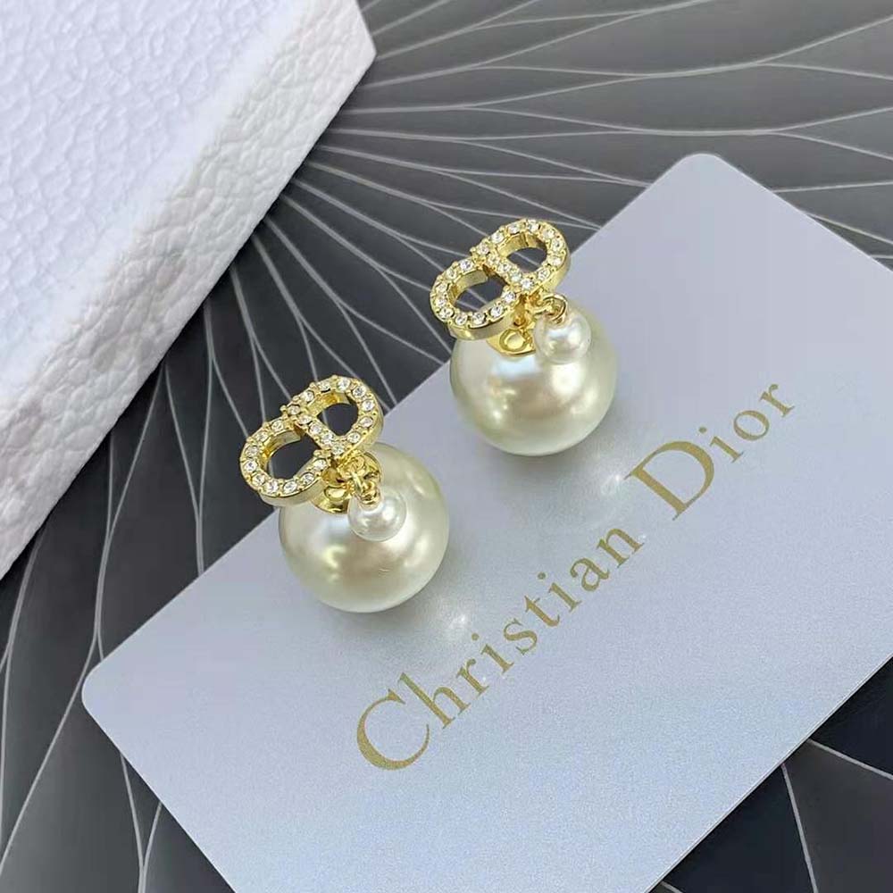 Side angle showcasing double-sided silhouette of Dior Women Tribales Earrings