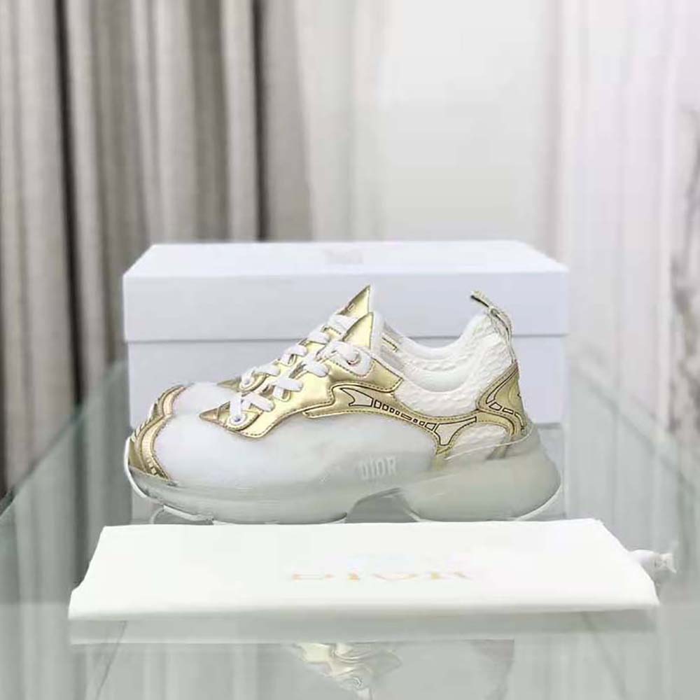 Close-up on gold-tone leather and signature branding on Dior Women Vibe Sneaker