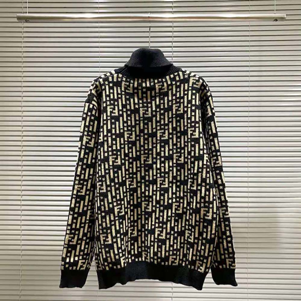 Side angle showcasing fit and subtle Dior hardware on black sweater