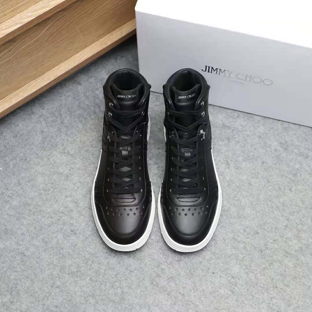 Close-up of black calf leather and metal hardware on Jimmy Choo high tops