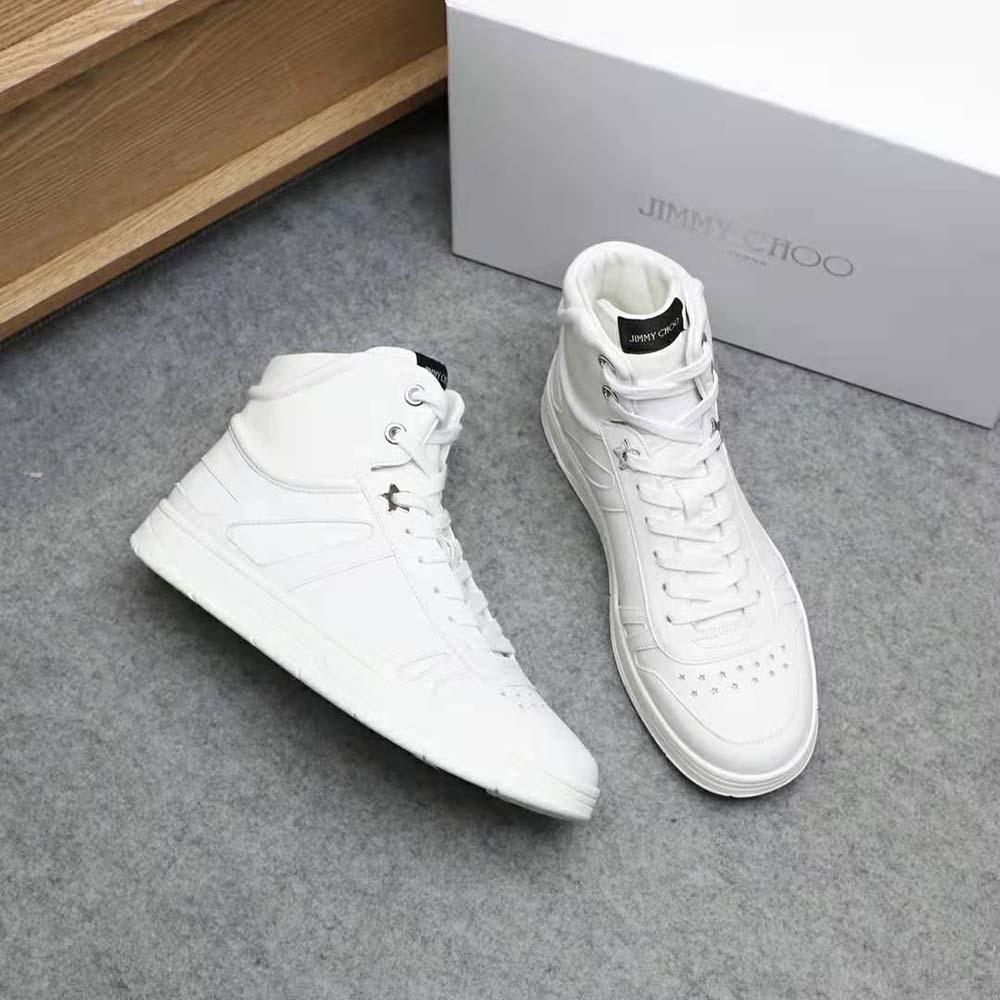 Overhead view showcasing white calf leather and lace-up detail of Jimmy Choo trainers