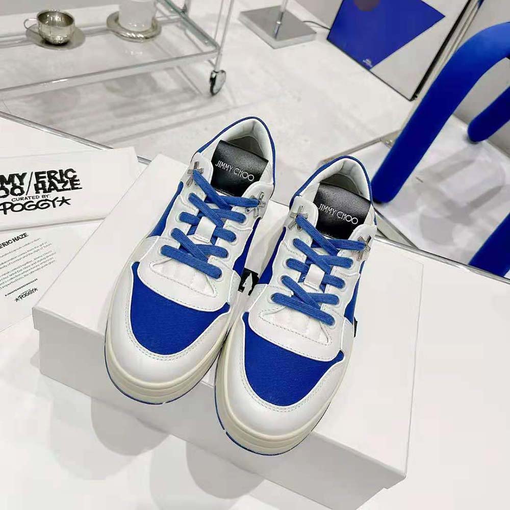 Close-up of blue canvas and white calf leather detail on Jimmy Choo trainers