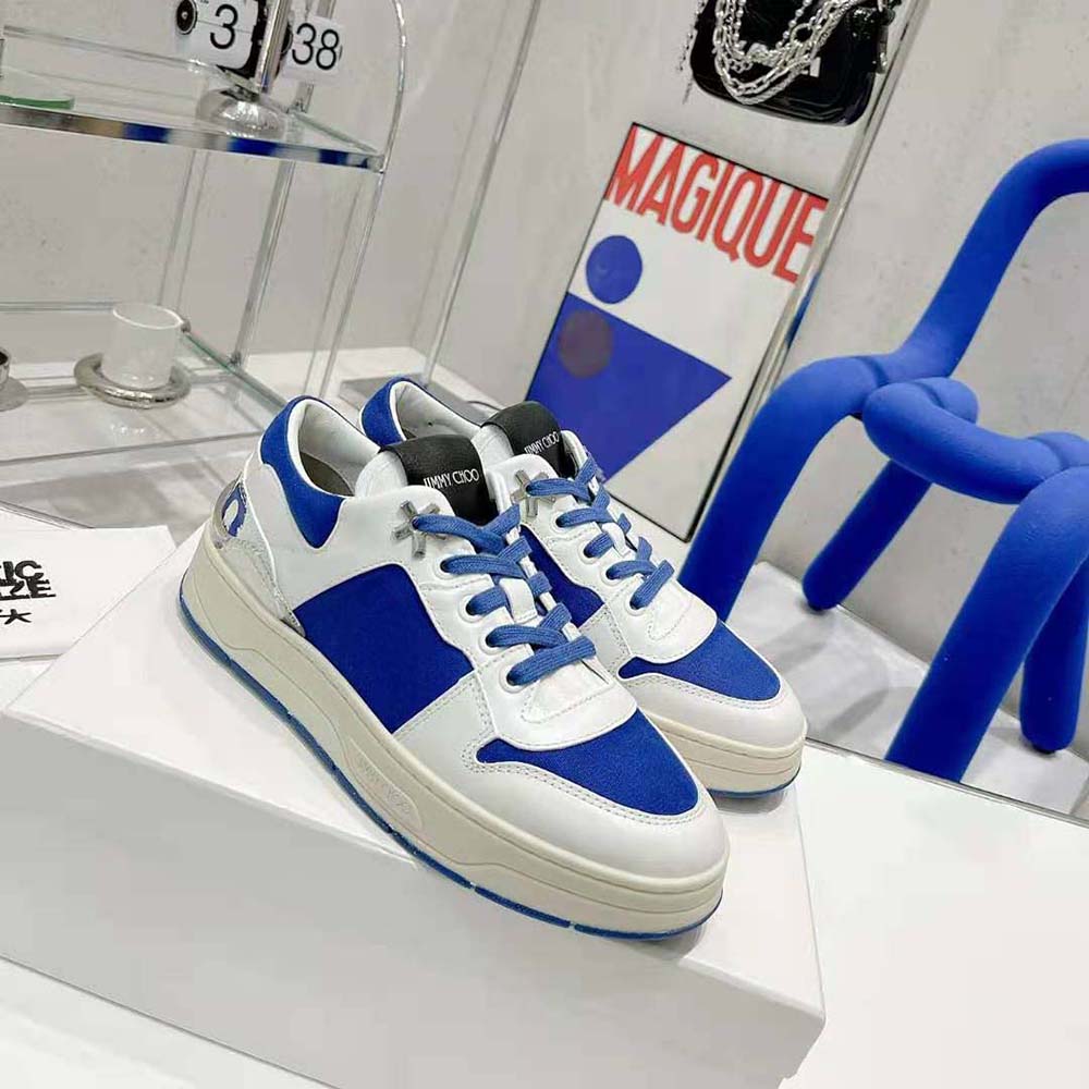 Top-down angle showing laces and signature logo on Jimmy Choo Eric Haze sneakers
