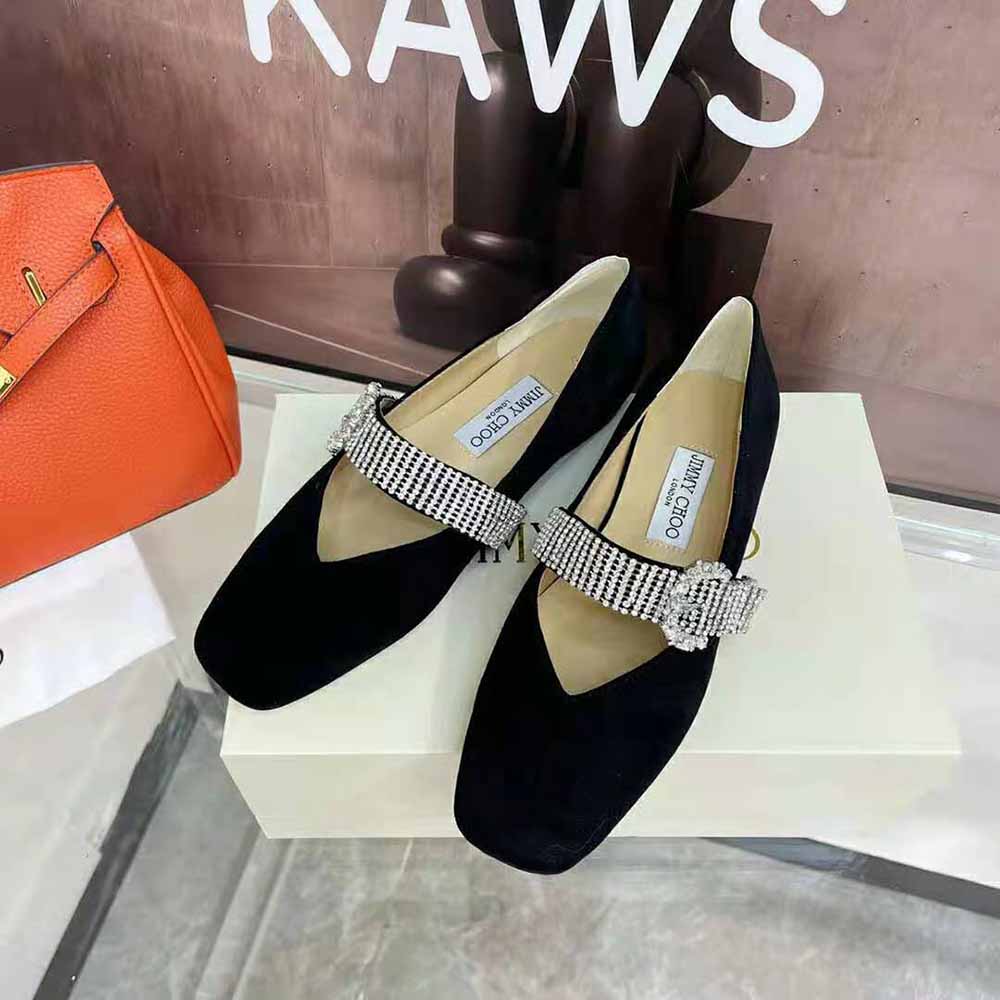 Rear shot highlighting black suede and silhouette of Jimmy Choo Krista Flats