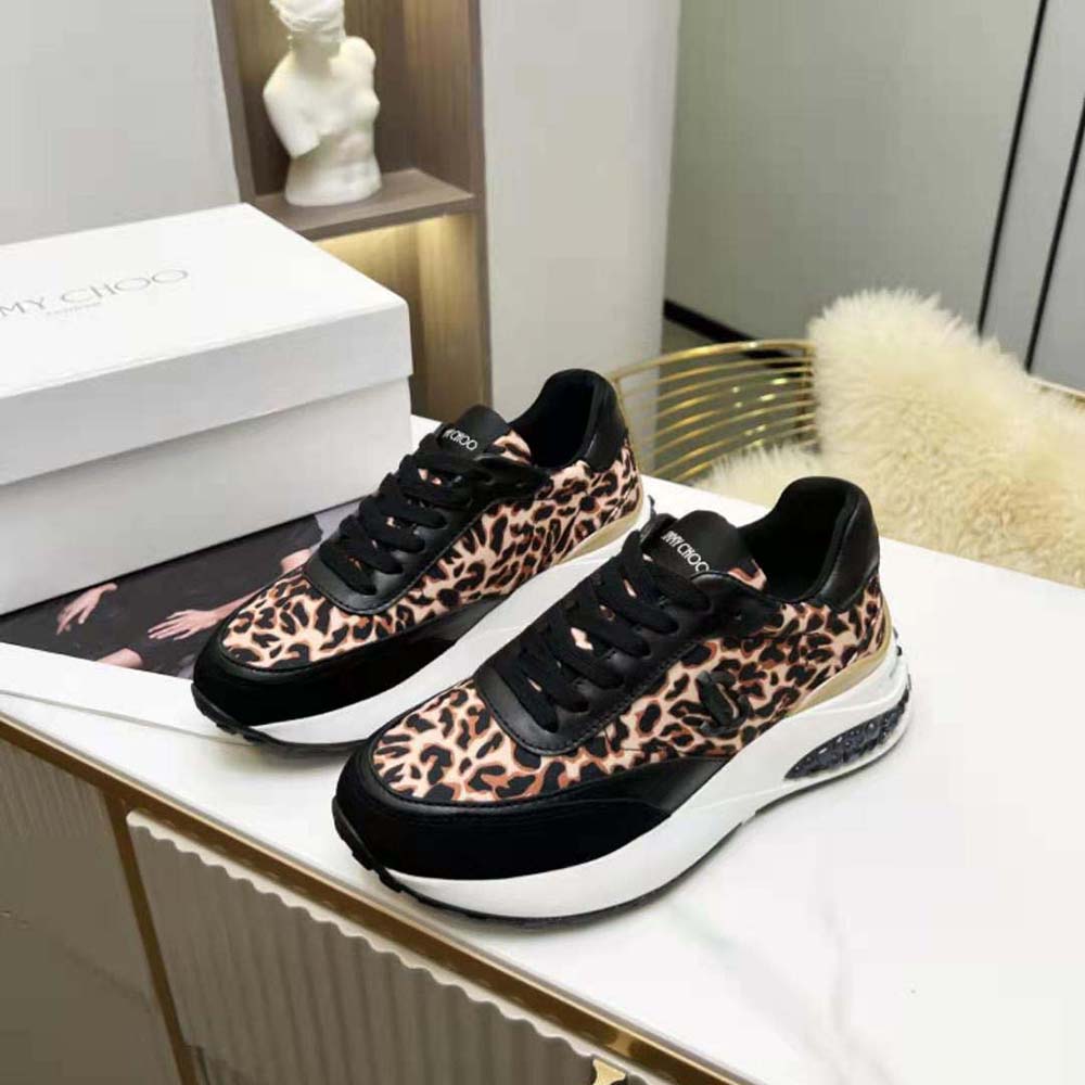 Top view showing interior cushioning and signature logo on Jimmy Choo sneaker