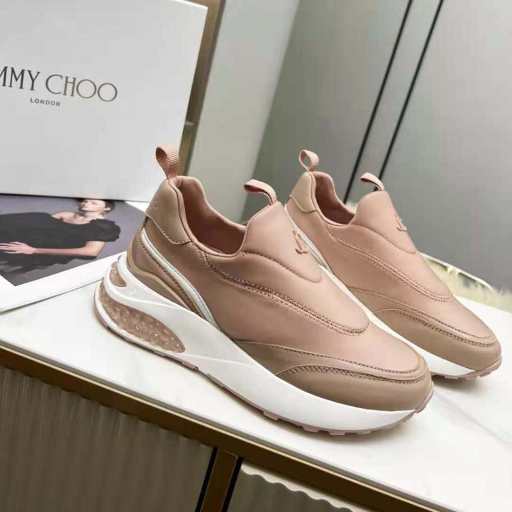 Close-up on pink leather and neoprene mix detailing on Jimmy Choo trainers