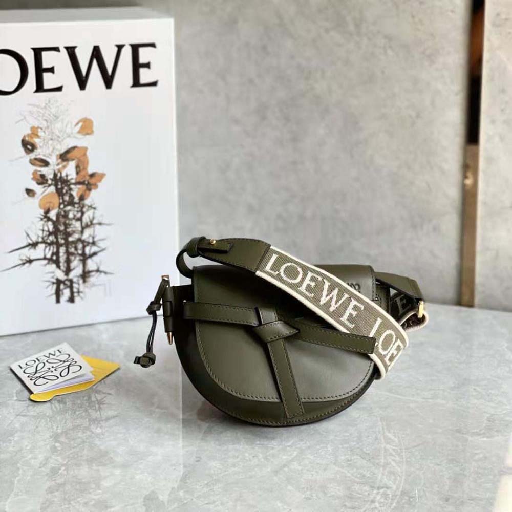 Close-up of green jacquard fabric and gold hardware on Loewe Mini Gate Dual Bag