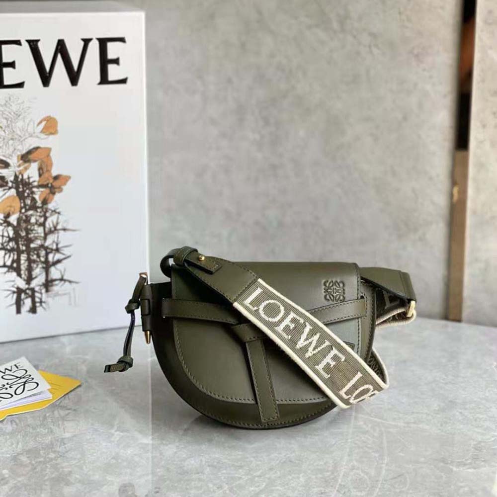 Side view showing compact silhouette and adjustable strap of Loewe Mini Gate Dual Bag