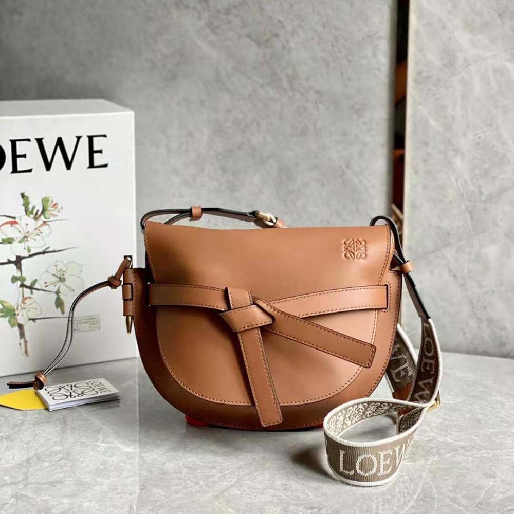 Close-up of gold anagram hardware on Loewe Women Small Gate Bag