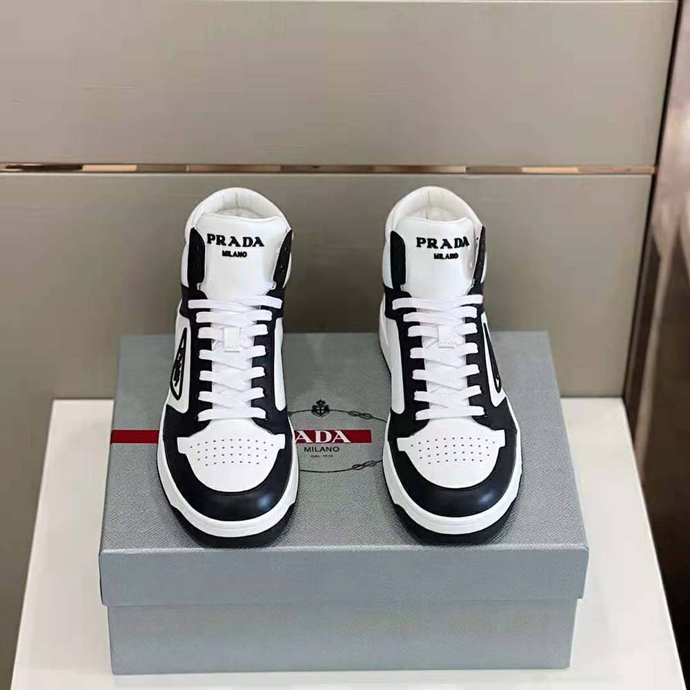 Top-down angle showing black leather and high-top silhouette