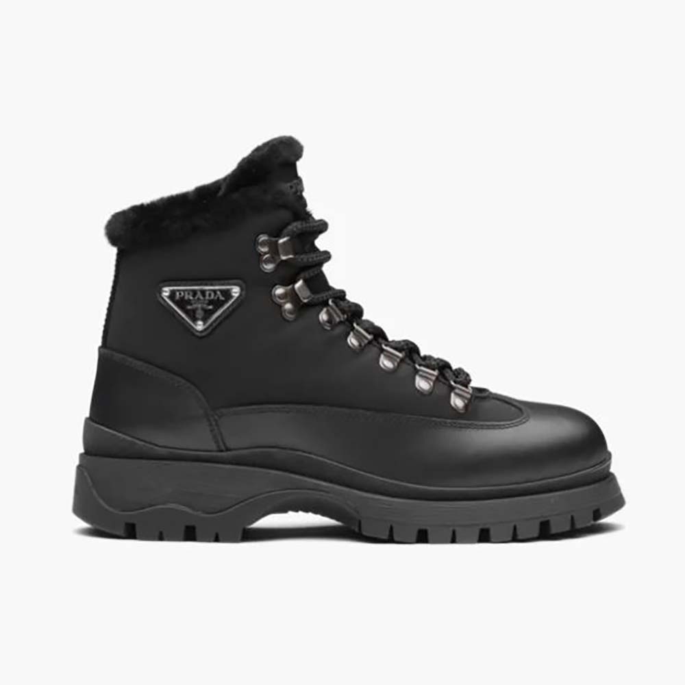 Side profile of Prada Women Brixxen Leather and Nylon Booties-Black