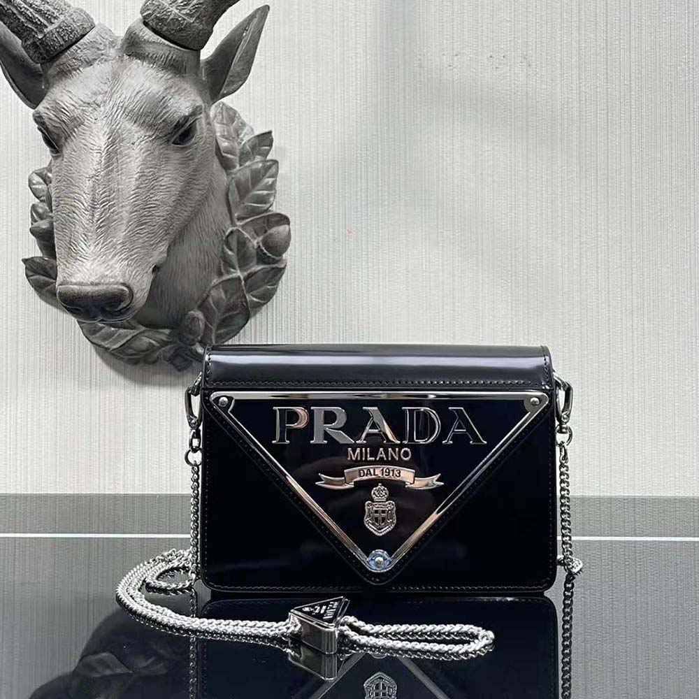 Side angle showing adjustable strap and magnetic closure of Prada Women Brushed Leather Shoulder Bag-Black