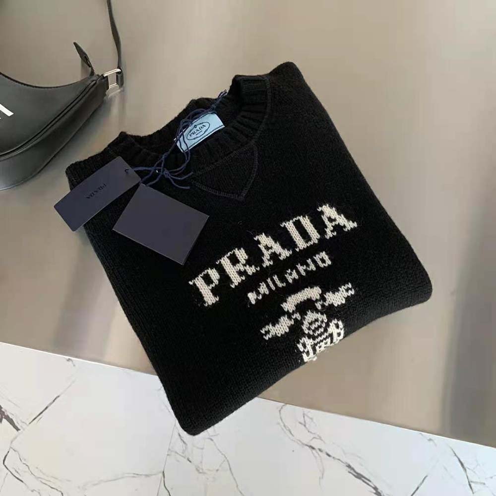 Side angle showing relaxed fit of Prada Women Cashmere and Wool Prada Logo Crew-Neck Sweater-Black