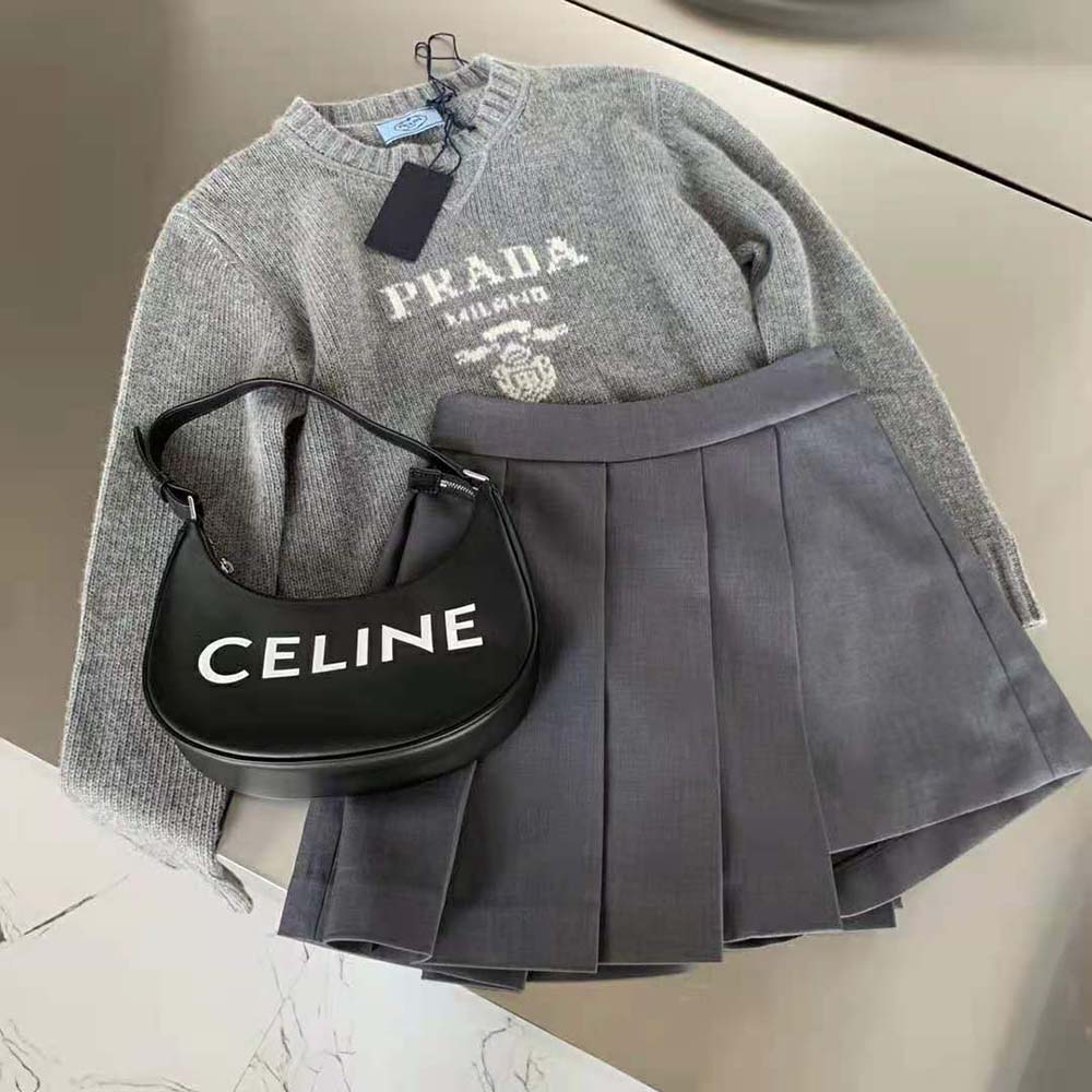 Side profile showing fit of Prada Women Cashmere and Wool Prada Logo Crew-Neck Sweater-Silver