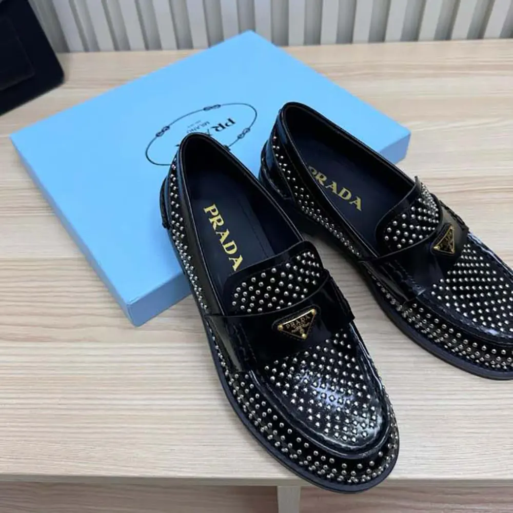 Close-up on crystal details of Prada Women Chocolate Satin Loafers