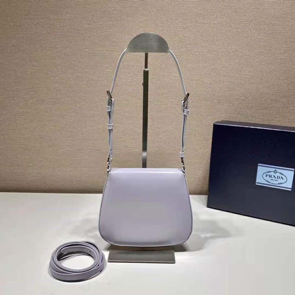 Side angle showing purple leather and slim silhouette of Prada mini bag