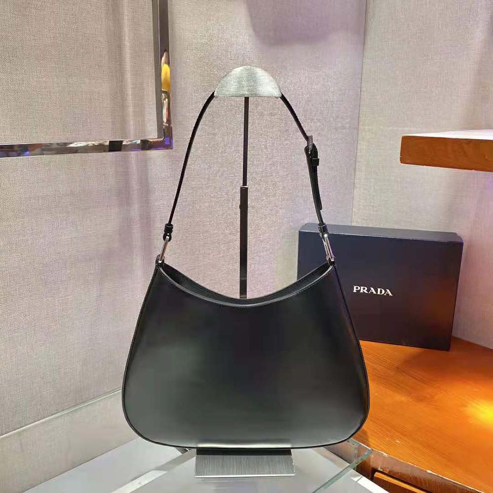 Side angle showing curved silhouette of Prada Women Cleo Brushed Leather Shoulder Bag-Black
