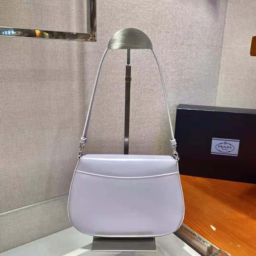 Side view showing slim silhouette of Prada Women Cleo Shoulder Bag in purple