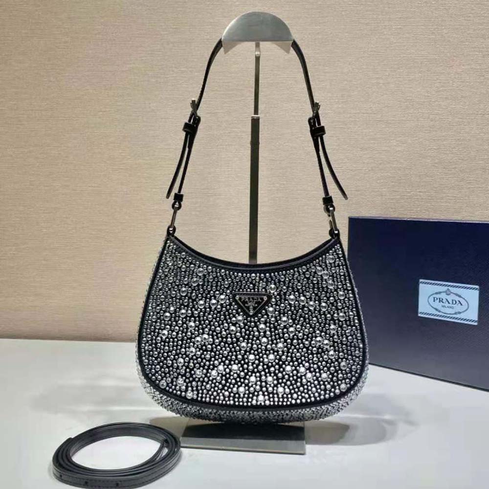 Close-up detail of appliques and silver hardware on Prada Women Cleo Satin Bag