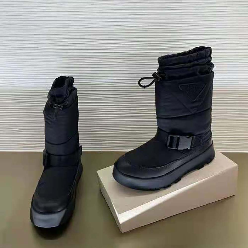 Top-down view highlighting black nylon texture on Prada booties