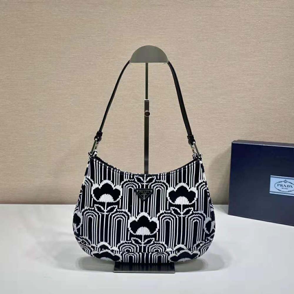 Close-up of silver-tone hardware on Prada Women Prada Cleo Jacquard Knit and Leather Bag
