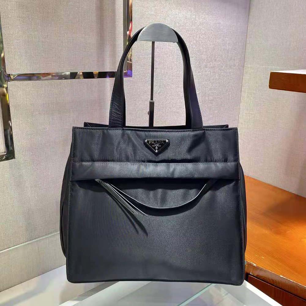 Close-up of silver-tone hardware on Prada Women Quilted Nylon Tote Bag-Black
