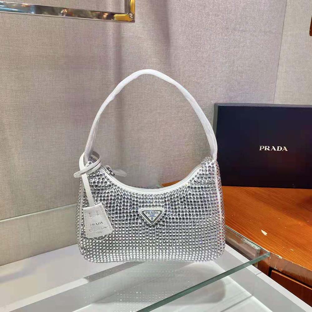 Close-up of artificial crystals on Prada Women Satin Mini-Bag white satin