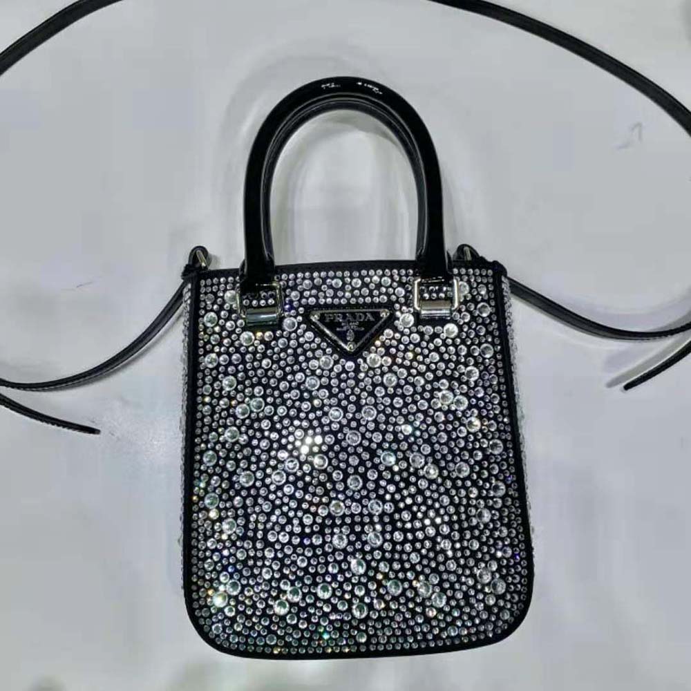 Side angle of Prada Women Small Crystal-Studded Satin Tote Bag-Black showcasing silhouette