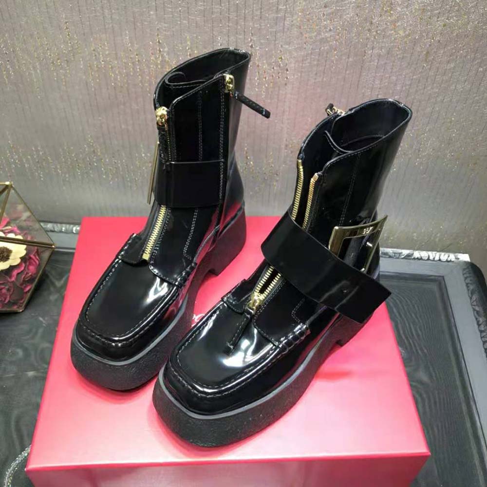 Top angle showing black leather and platform sole of Roger Vivier boots