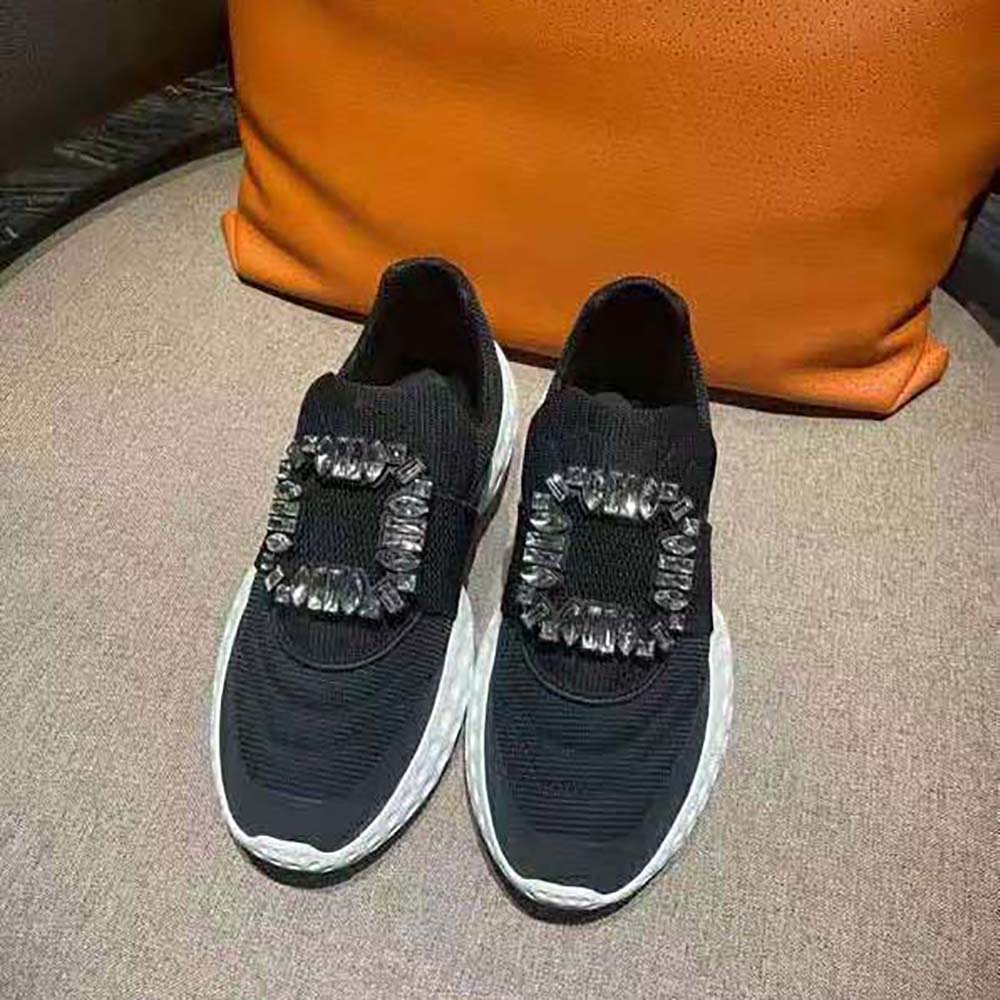 Close-up of sparkling strass buckle on Roger Vivier black sneakers