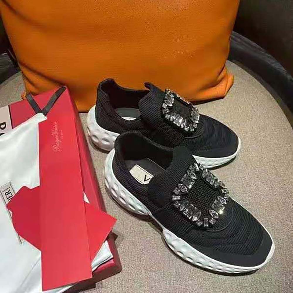 Top angle showing lace-up detail of Roger Vivier black fabric sneakers