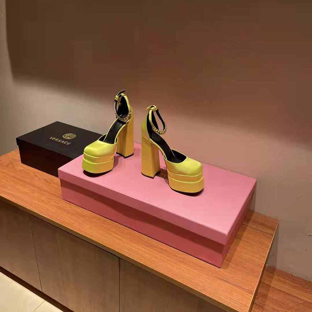 Front angle highlighting yellow leather straps of Versace Women Medusa Aevitas Platform Pumps-Yellow