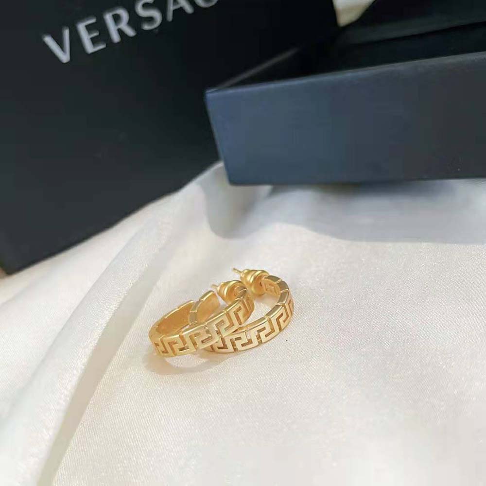 Side angle of Versace Women Small Greca Hoop Earrings-Gold highlighting sleek hoop silhouette