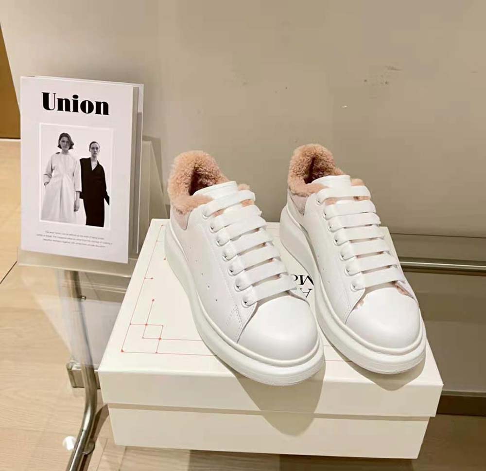Top angle showing lace-up closure and oversized sole on Alexander Mcqueen sneaker