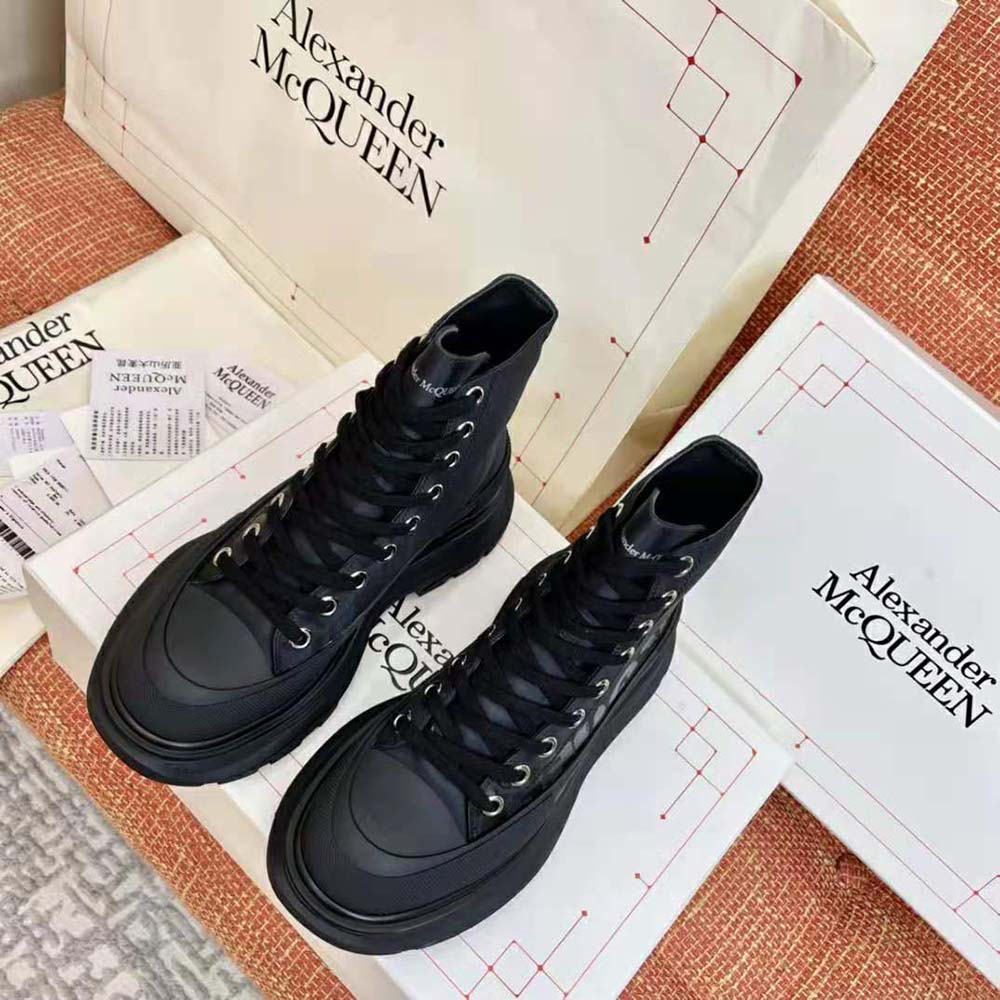 Close-up of lace-up detail on Alexander Mcqueen Women Tread Slick Boot Black Polyfaille