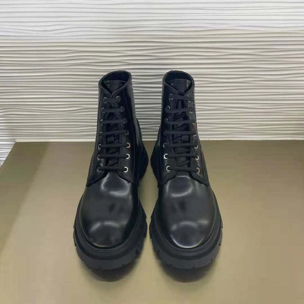 Close-up on lace-up and shiny leather detail of Alexander Mcqueen Women Wander boot