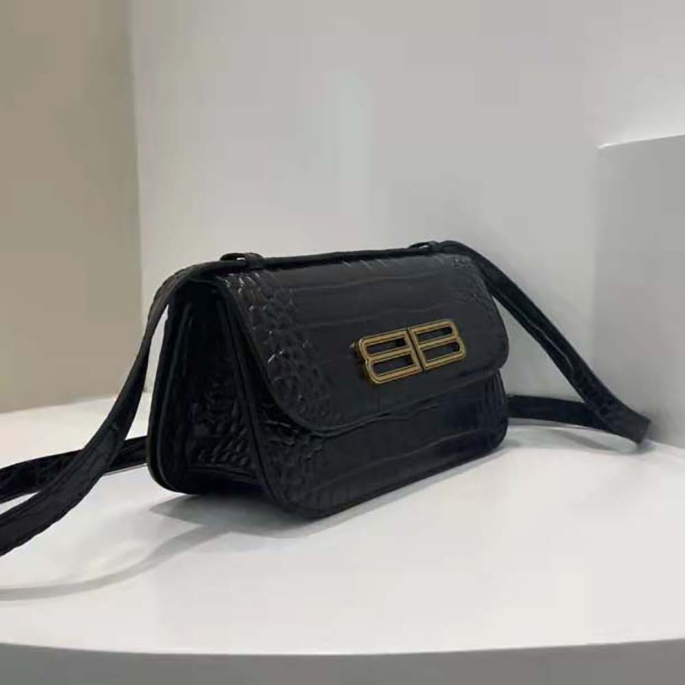 Side angle showcasing slim profile and flap closure of Balenciaga Women Gossip Small Bag
