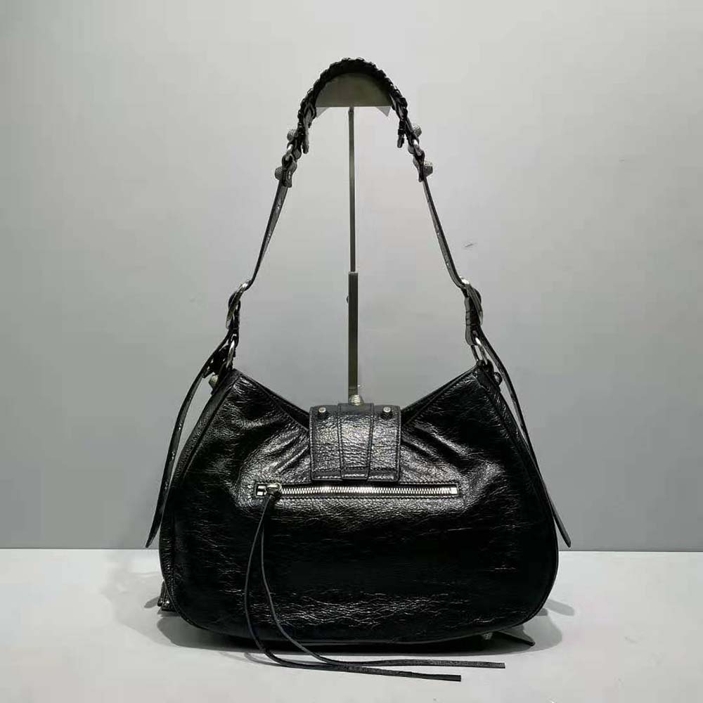 Side profile showing structured silhouette of Balenciaga Le Cagole bag