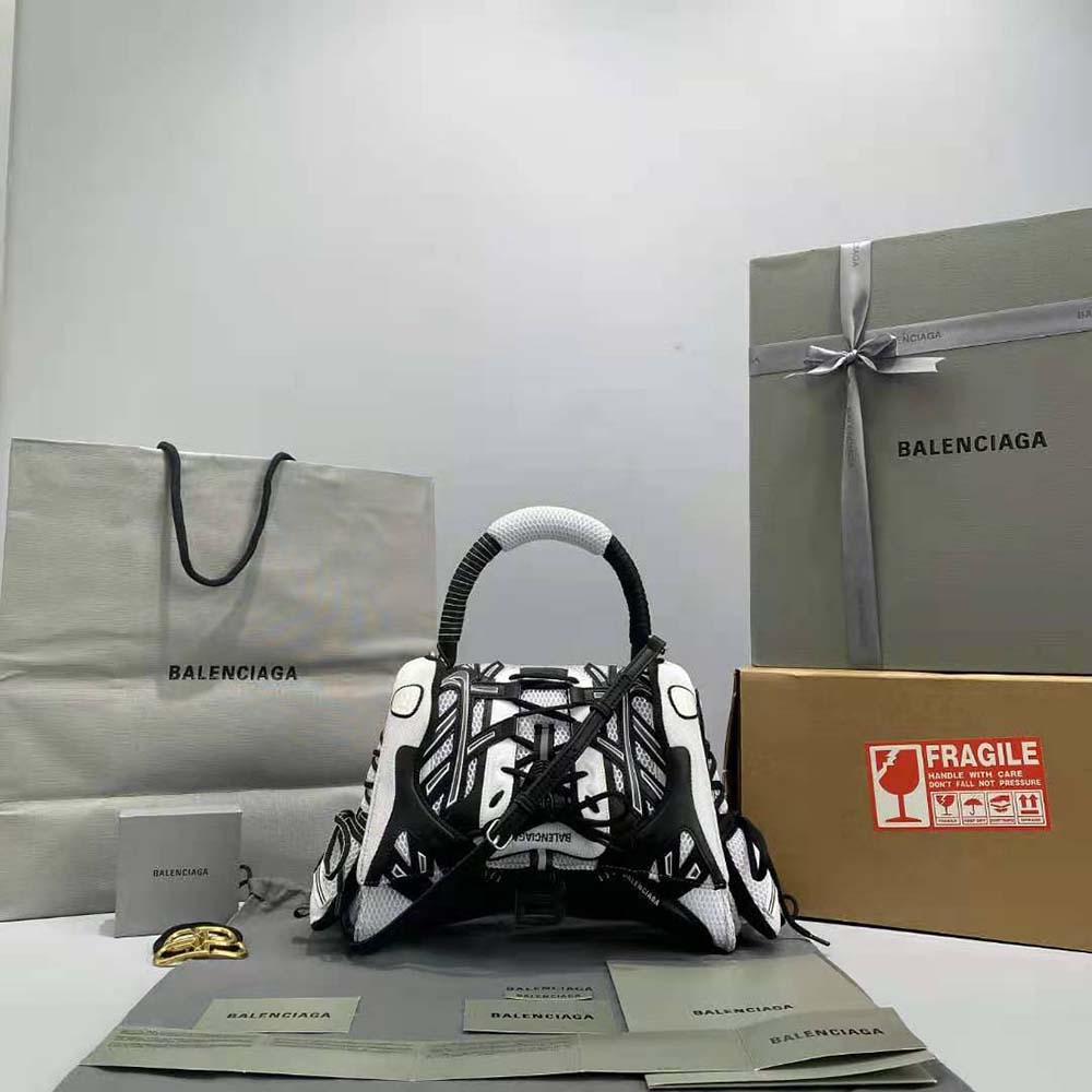 Close-up of Balenciaga logo and silver hardware on sneakerhead bag