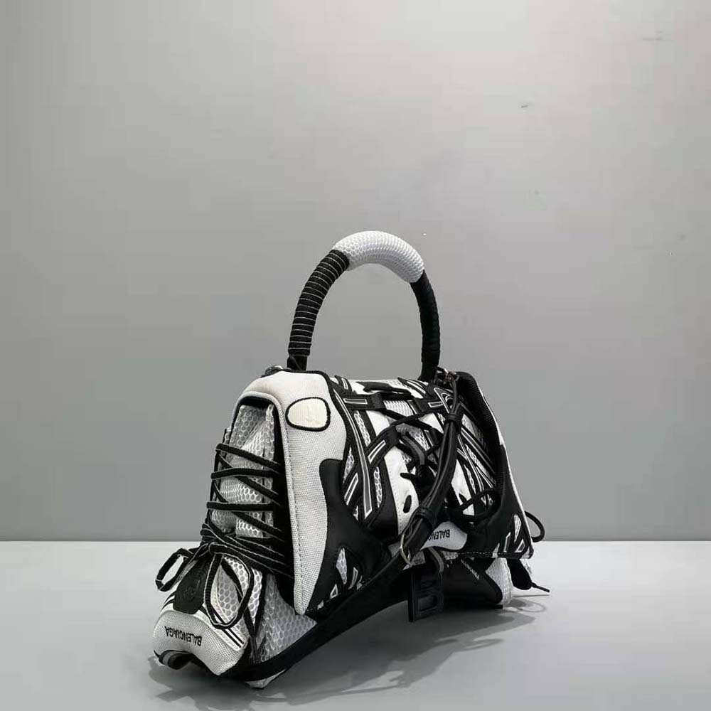 Side angle showing compact silhouette of Balenciaga Women Sneakerhead bag