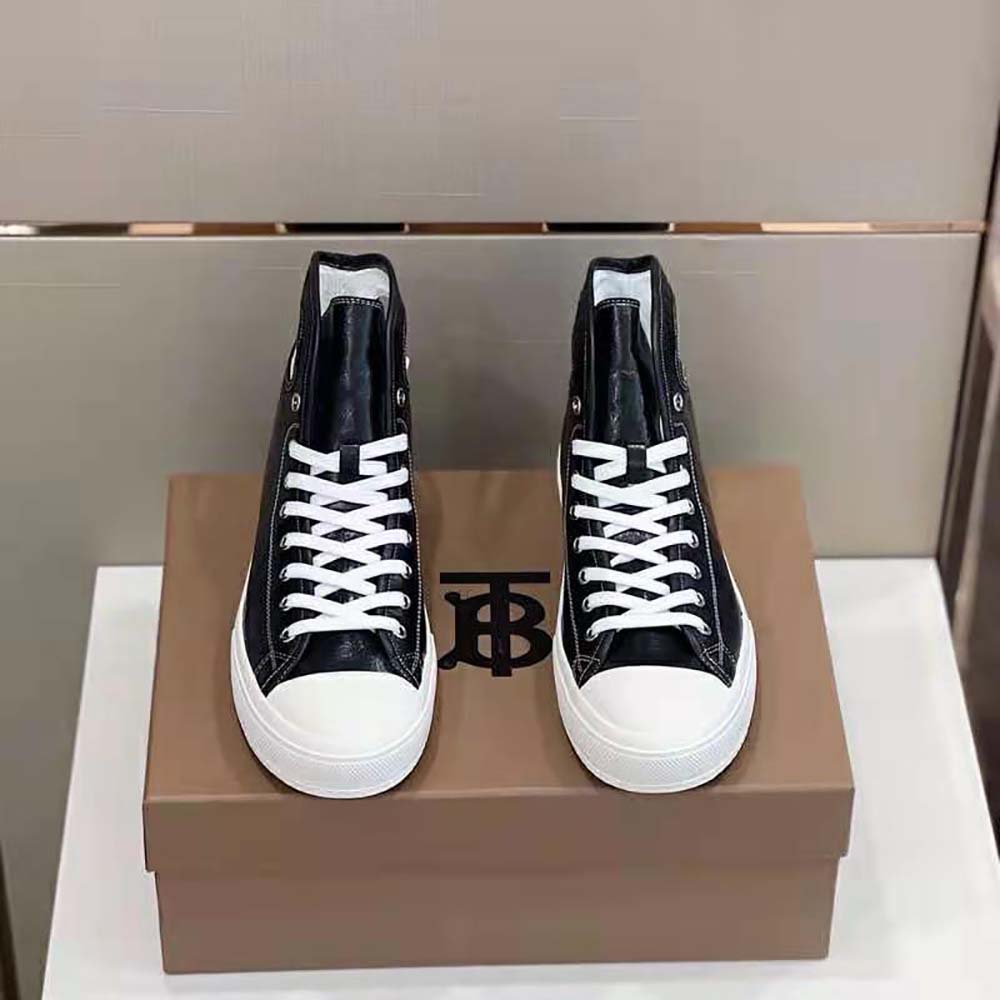Close-up on metal porthole detail of Burberry Men Porthole Detail Leather High-top Sneakers-Black