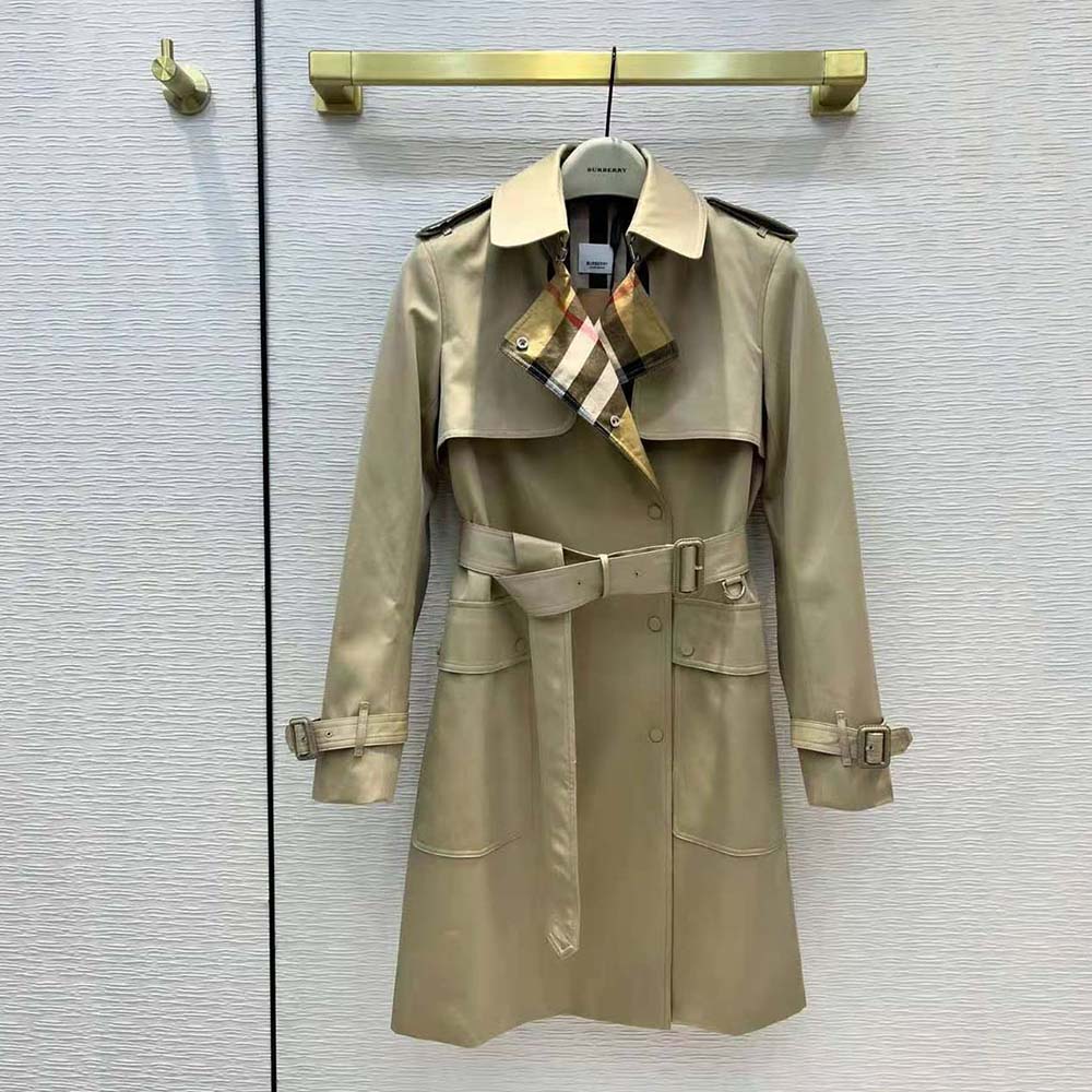 Close-up of Burberry check panel detail on trench coat collar