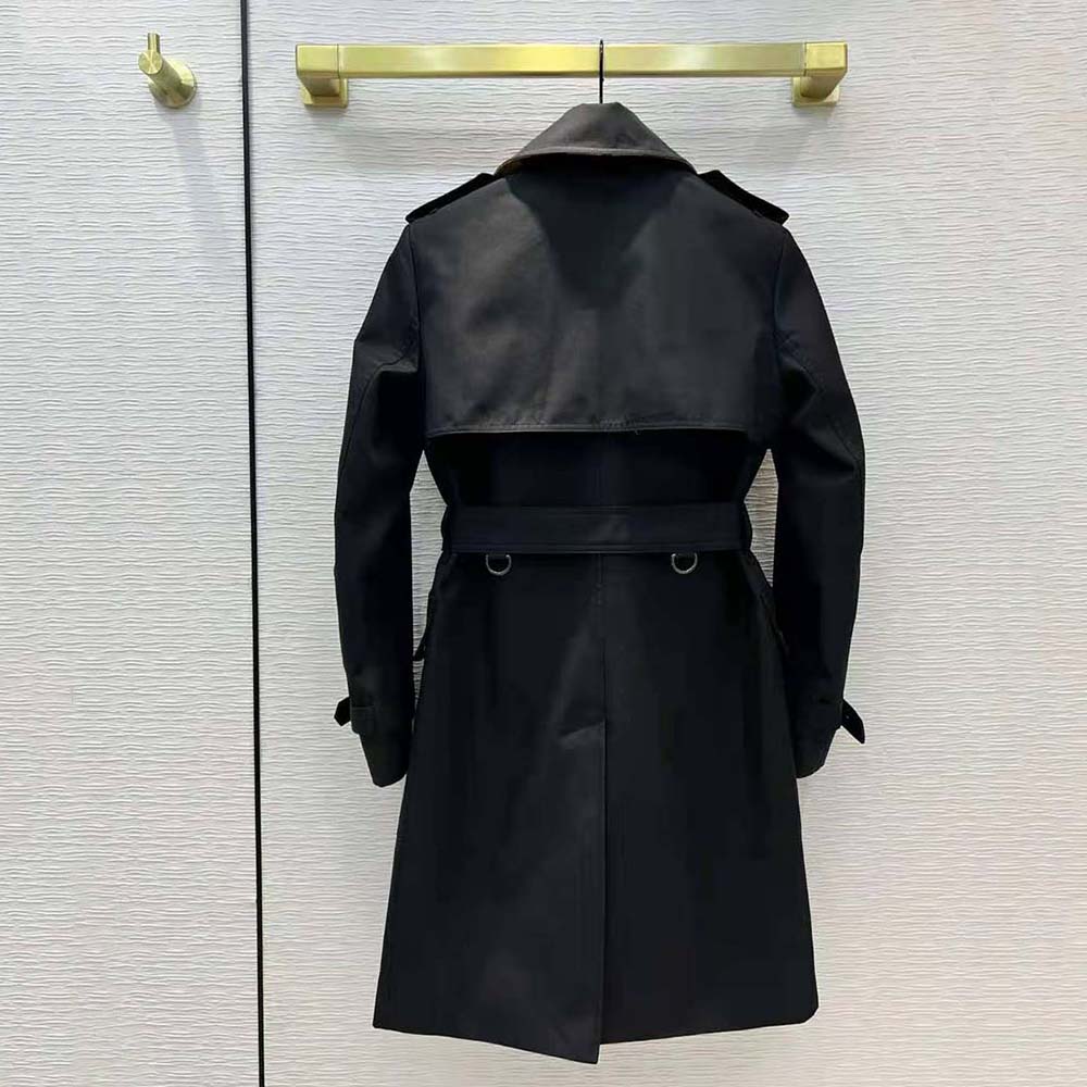Side angle of Burberry Women Check Panel Cotton Gabardine Trench Coat-Black highlighting silhouette