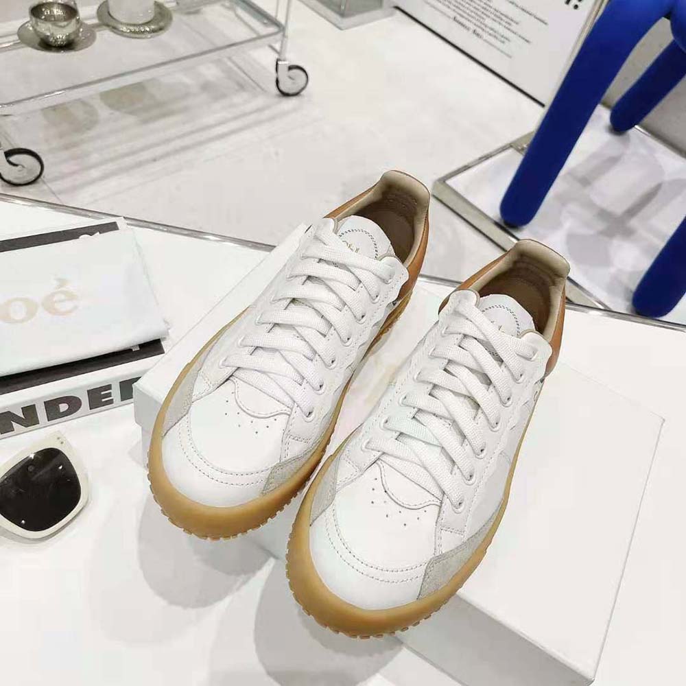 Close-up of gold logo hardware on Chloe Women Franckie Low-Top Sneaker