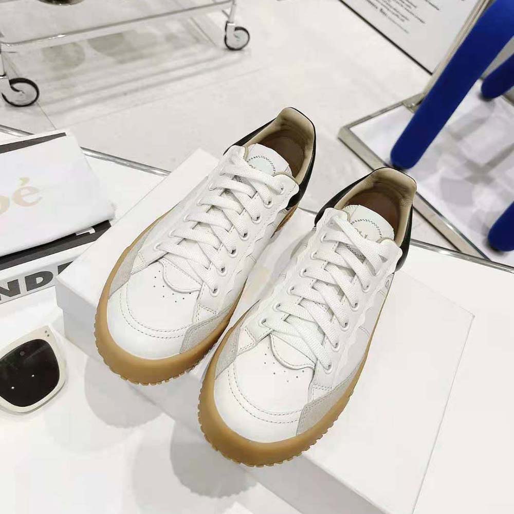 Close-up of black calfskin leather and embossed Chloé logo on sneaker