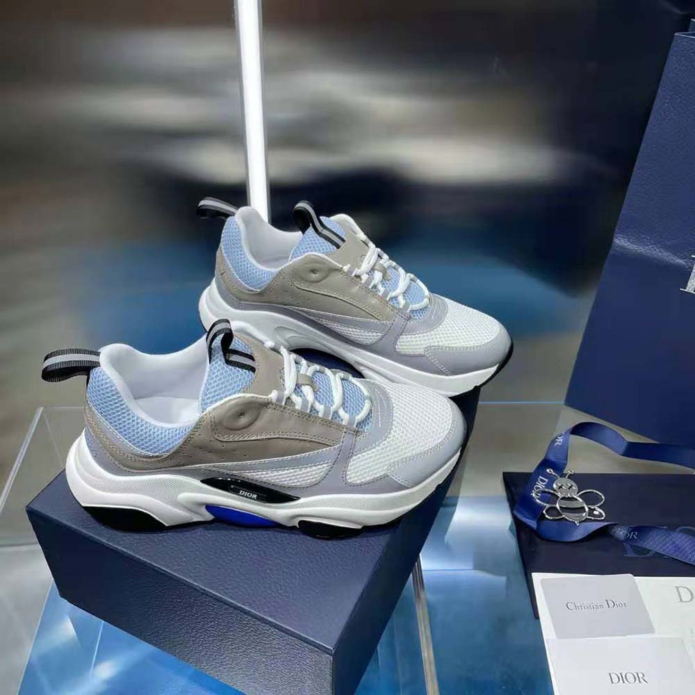 Side profile of Dior Men B22 Sneaker showcasing signature Dior ‘D’ hardware